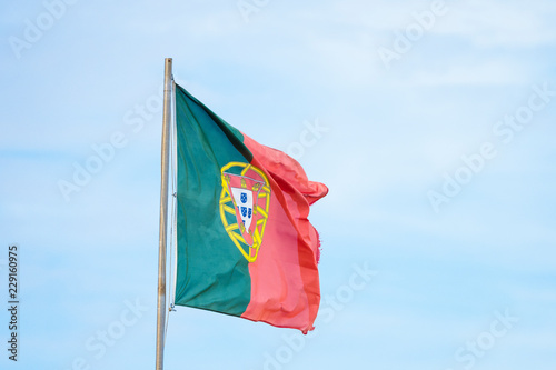 Fotografia Portuguese flag waving on the strong wind