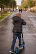 © Irina - Little boy riding scooter in the park, kids sport