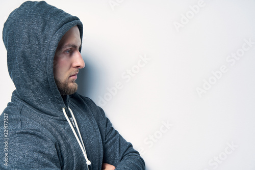 Download Closeup Side View Portrait Of A Man Dressed In A Grey Hoodie Looking Forward At Blank Copy Space Stock Photo Adobe Stock