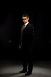 © Netfalls - A serious man in a black suit.