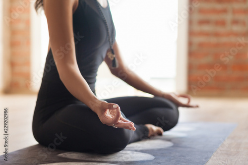 Fotografía Yoga instructor meditates In an empty bright room