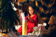 © master1305 - Merry Christmas and Happy Holidays. Cute little child girl writes the letter to Santa Claus near Christmas tree at home indoor. The holiday, childhood, winter, celebration concept