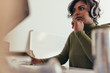 © Jacob Lund - Female programmer working on computer