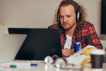 Man busy coding on laptop t tech startup