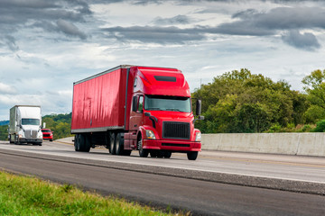 Wall Mural - Red Semi Tractor-Trailer Travels The Interstate Highway