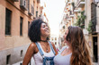 © santypan - Beautiful women having fun in the street.