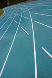 Fototapeta  - running racetrack with white lines on blue ground