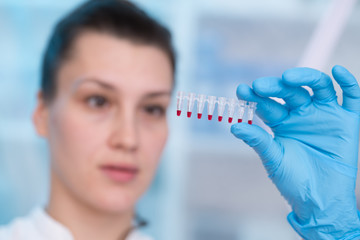 Wall Mural - Young woman with genetic research in the laboratory research of cancer diseases