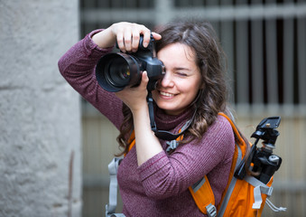 Wall Mural - girl photographer with camera