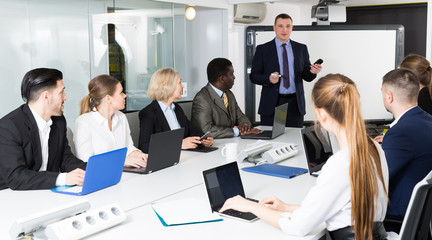 Wall Mural - Businessman speaker giving talk on corporate business meeting