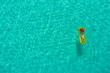© gawriloff - Aerial view of slim woman swimming on the swim mattress in the transparent turquoise sea in Seychelles. Summer seascape with girl, beautiful waves, colorful water. Top view from drone