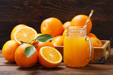Glass Jar Of Fresh Orange Juice With Fresh Fruits