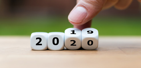 Wall Mural - Dice symbolize the change to the new year 2020