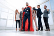 © ASDF - boss is a superhero and the business team is standing together
