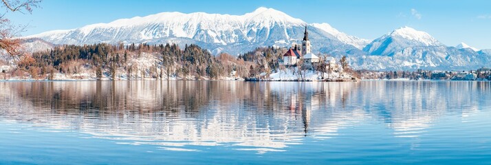 Fototapete - Lake Bled with Bled Island and Castle at sunrise in winter, Slovenia