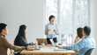 © MaaHoo Studio/Stocksy - Businesswoman leading meeting in conference room