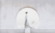 © Colin Anderson/Stocksy - Profile of woman wearing white kimono standing in stone Zen garden