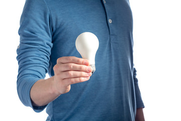 Man holding a light bulb on a white background