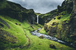 © Jordan - Waterfall in rugged Iceland valley - Kvernufoss