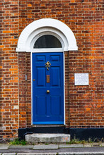 Blue Door On Red Brick