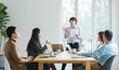 © MaaHoo Studio/Stocksy - Businesswoman leading meeting in conference room