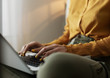 © Milles Studio/Stocksy - Crop woman typing on laptop