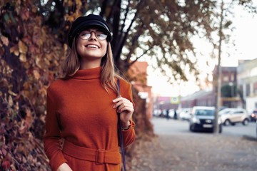 season and people concept - Autumn portrait of happy girl. Outdoor beauty portrait woman, fashion model, pretty girl, street style.