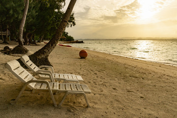 Wall Mural - Two chair on sand beach in afternoon