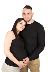 Wall Mural - Happy pregnant woman in love with man husband in studio on white wall