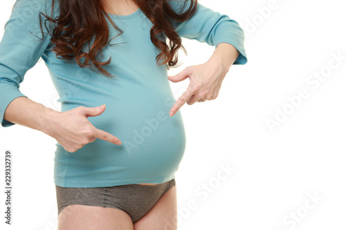 自分のお腹を指差して妊娠していることをアピールする水色のシャツを着た臨月の妊婦 Buy This Stock Photo And Explore Similar Images At Adobe Stock Adobe Stock 自分のお腹を指差して妊娠していることをアピールする水色のシャツを着た臨月の妊婦 Buy This Stock Photo And Explore Similar Images At Adobe Stock Adobe Stock