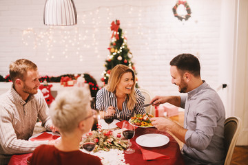 Wall Mural - Happy family christmas eve. Christmas friends.