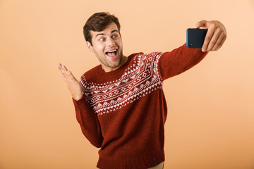 Canvas Print - Portrait an excited young man standing