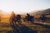 Stunning image of the group of bikers in the evening light. Concept active extreme rest.