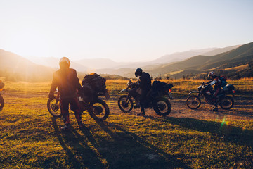stunning image of the group of bikers in the evening light. concept active extreme rest.