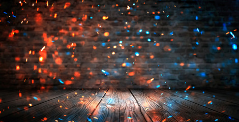 Wall Mural - dark basement room, empty old brick wall, sparks of fire and light on the walls and wooden floor. da