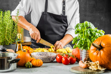 The chef slicing vegetables.