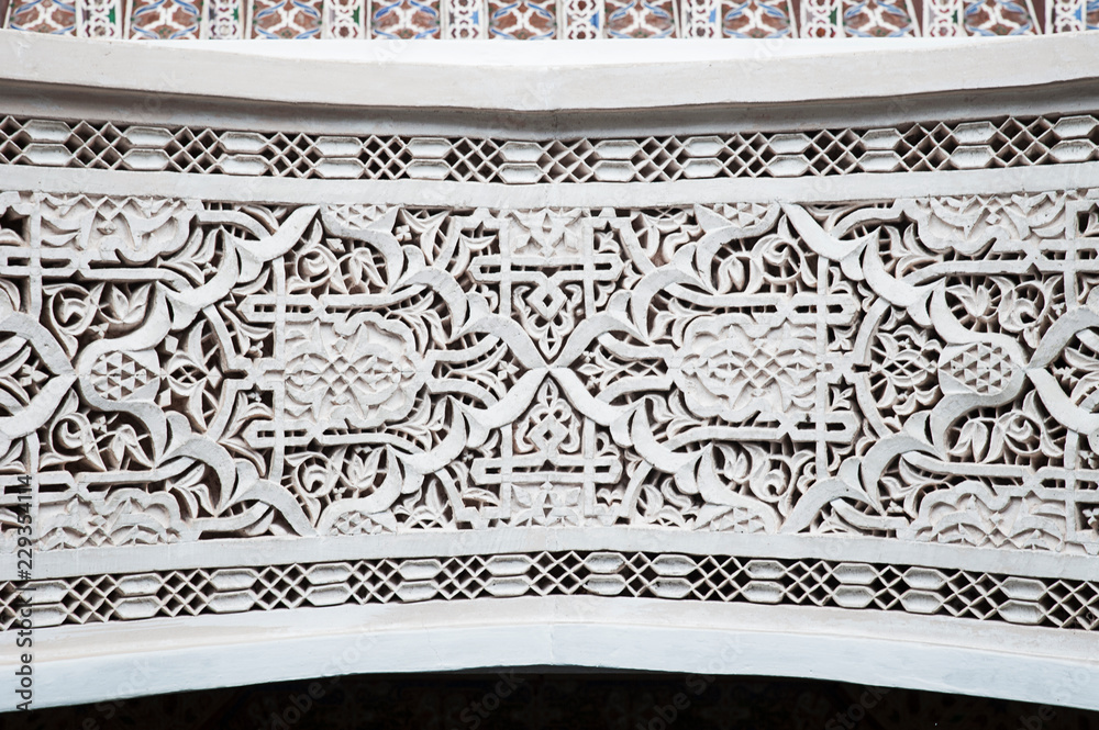 Moroccan intricate plaster work around doorway with traditional Moorish ...
