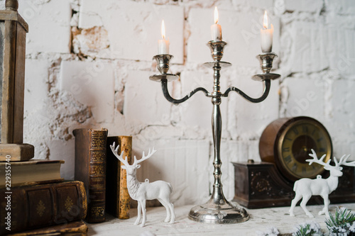 Vintage Christmas Decorations On The Fireplace Candles Books And