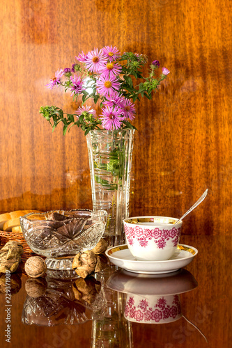 Crystal Vases Of Flowers Candy And Bread On A Polished Surface