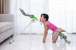Leinwandbild Motiv Asian Chinese little Girl playing workout machine in the living room