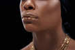 © LIGHTFIELD STUDIOS - cropped shot of african american woman with sparkling lip gloss isolated on black