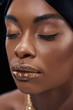 © LIGHTFIELD STUDIOS - portrait of beautiful african american woman with eyes closed isolated on black