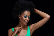 © LIGHTFIELD STUDIOS - portrait of attractive african american model with bright blue eyes shadows isolated on black
