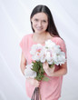 © yurolaitsalbert - portrait of a young woman with a bouquet of peonies