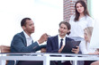 © yurolaitsalbert - closeup. international business team discussing business issues.