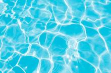 Blue And Bright Water In Swimming Pool With Sun Reflection, Motion Of Ripple Water And Gentle Wave In Pool