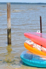 beach floats resting water inner tubes