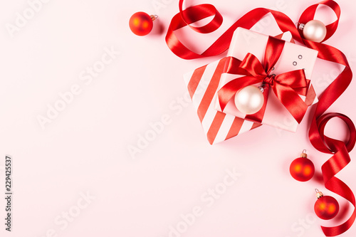 Christmas gift on pink background.