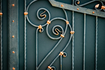 wrought-iron gates, ornamental forging, forged elements close-up