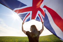 Girl With UK Flag In Green Field